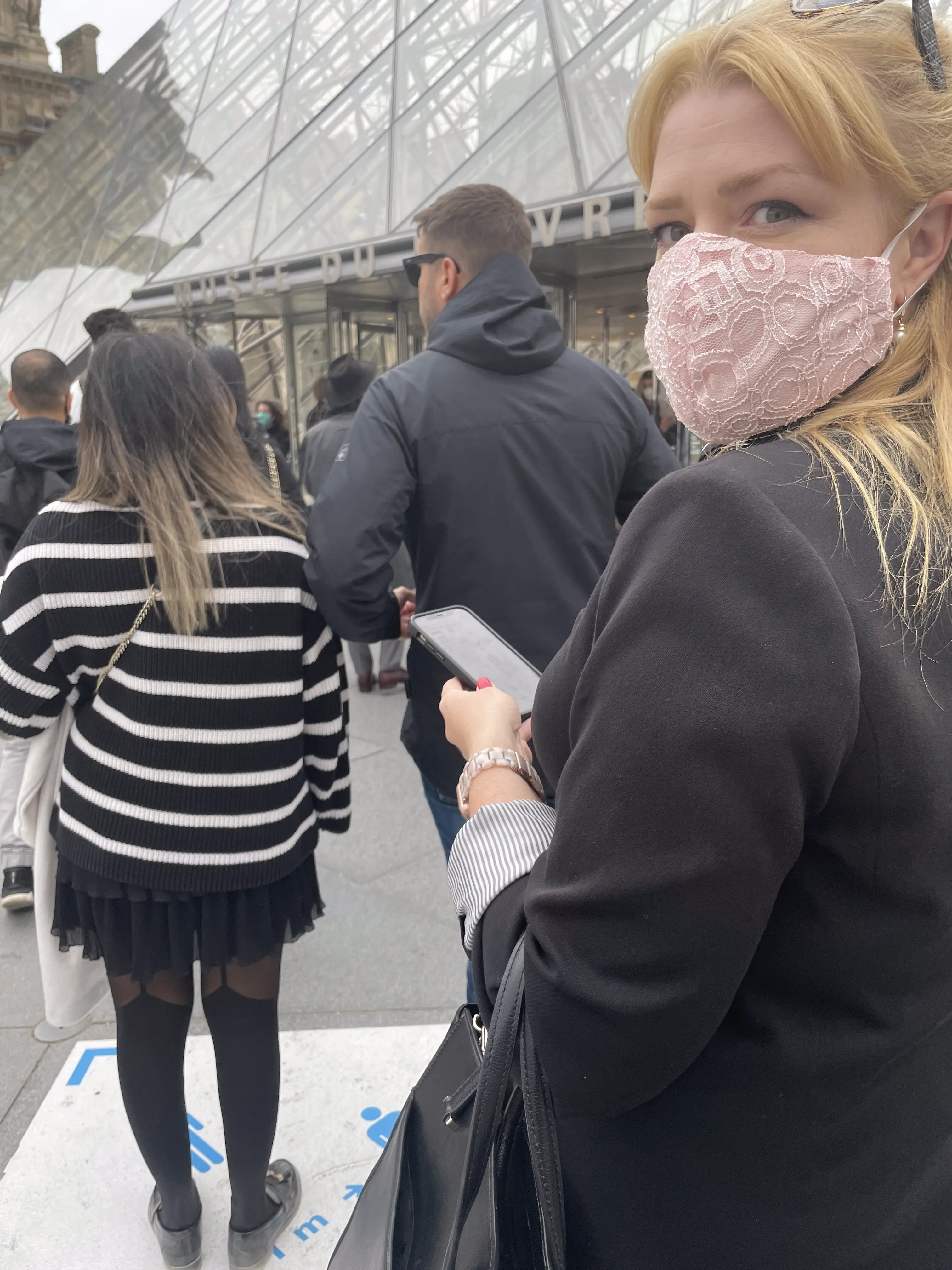 In line for our slot at the Louvre: masked with _pass sanitaire_ at the ready