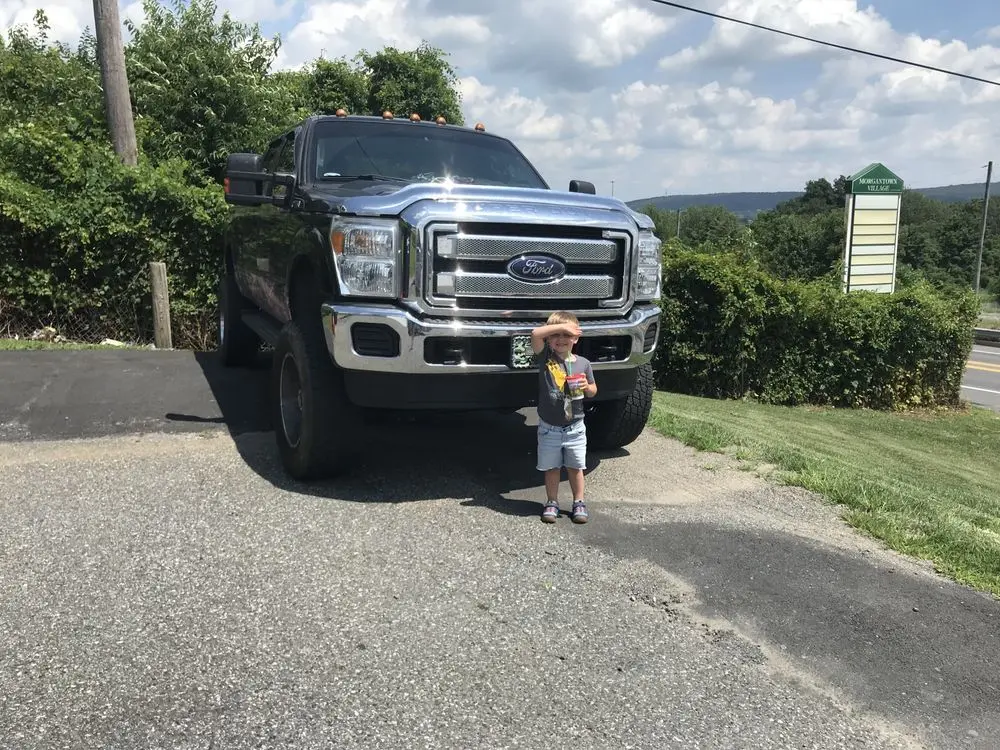 A four-year old in front of an F150