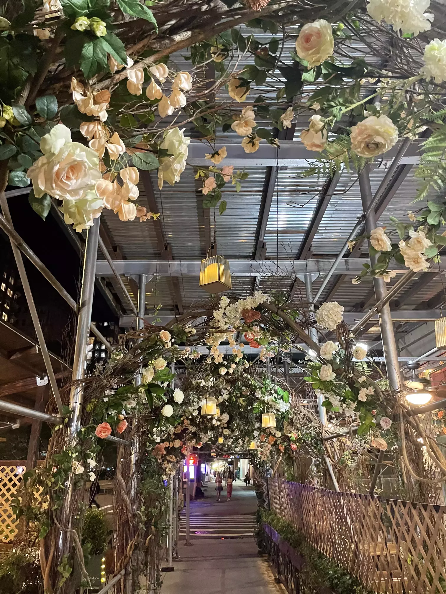 Cibo e Vino integrated their terrace (left) with their shanty (right) via the building scaffolding (above) and created a natural arch with flowers